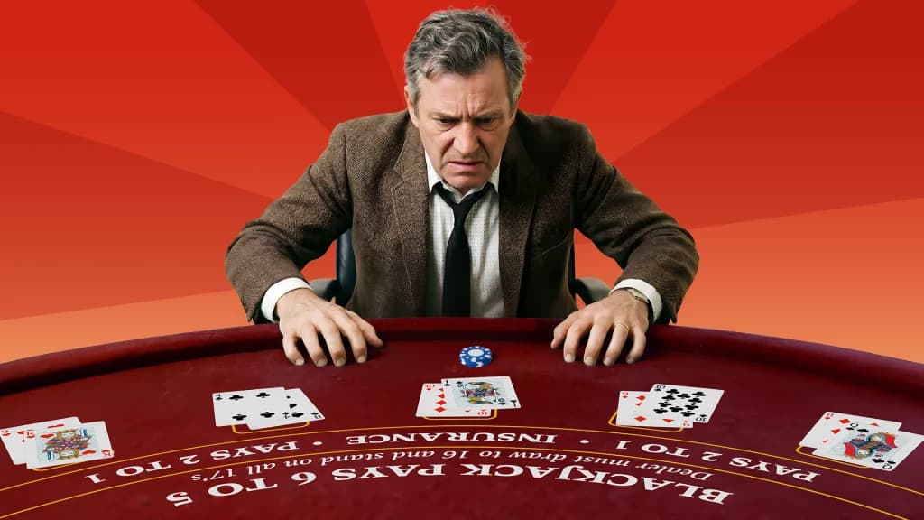 A blackjack player looks confused while observing his cards at a 6:5 table, which pays less for a natural.