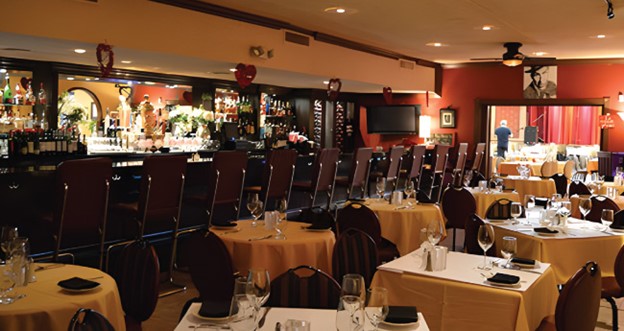 The Italian American Club, Las Vegas. Photograph of the dining room with set tables.