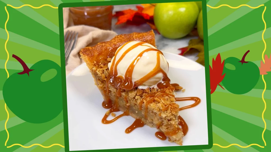 A close up shot of the caramel apple pie with ice cream on a green back ground with apples.