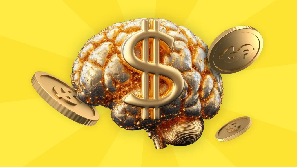 On a yellow background is a golden brain with a dollar sign and gold coins floating