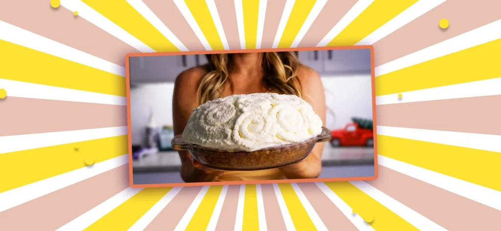 lindsay moser holds a banana cream pie topped with a mountain of whipped cream