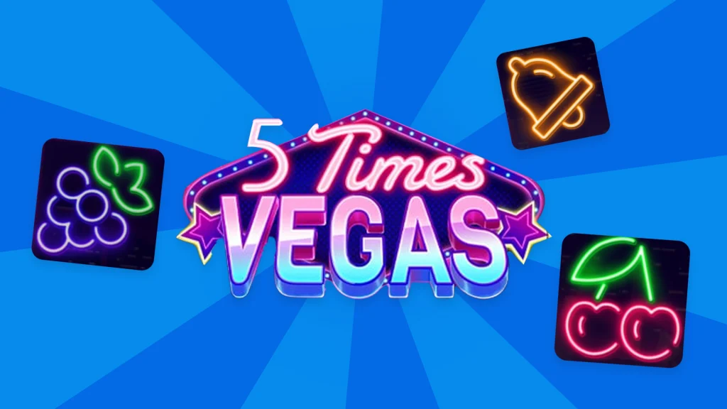 On a blue background, the game name “5 Times Vegas” is displayed in marquee lights with lit-up grape, bell, and cherry symbols around it. 