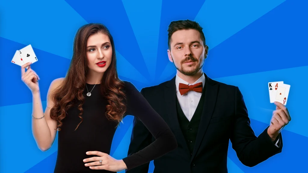 On a blue background, a woman and a man hold up two cards each that show a blackjack. 