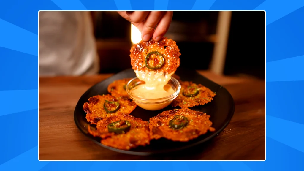 the final jalapeno popper crisps are being dipped into a sauce.